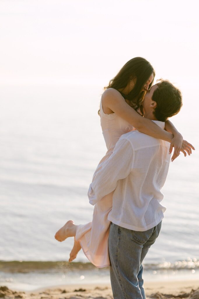 playful engagement session on the beach
