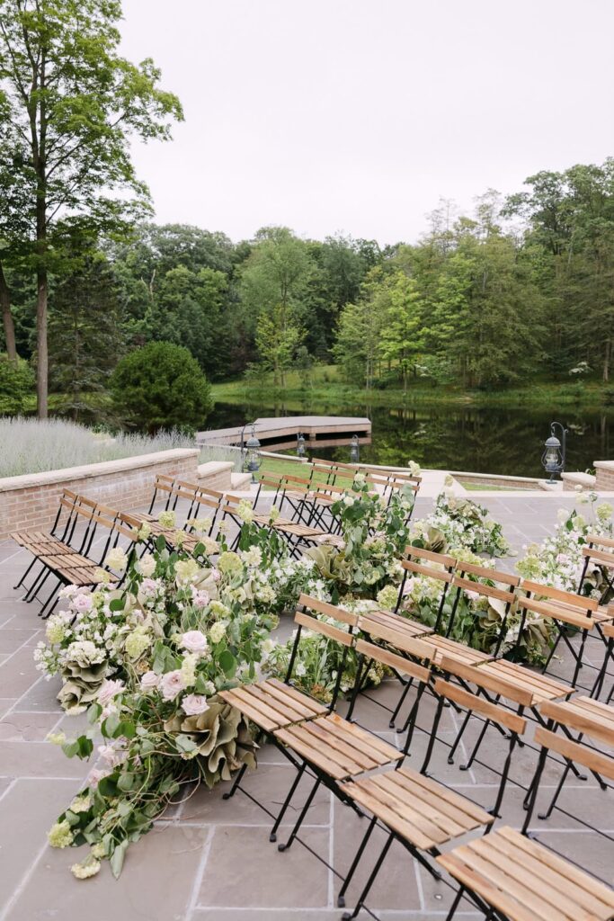 refined pondside ceremony with blooming florals and soft greenery-Elegant inspiration for Midwest weddings.
